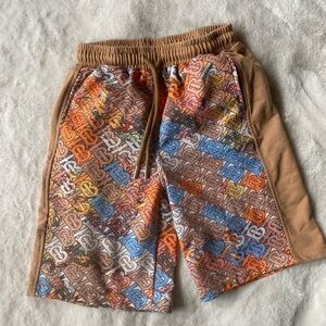 Boys size 10 knit colorful print shorts with an elastic waistband.